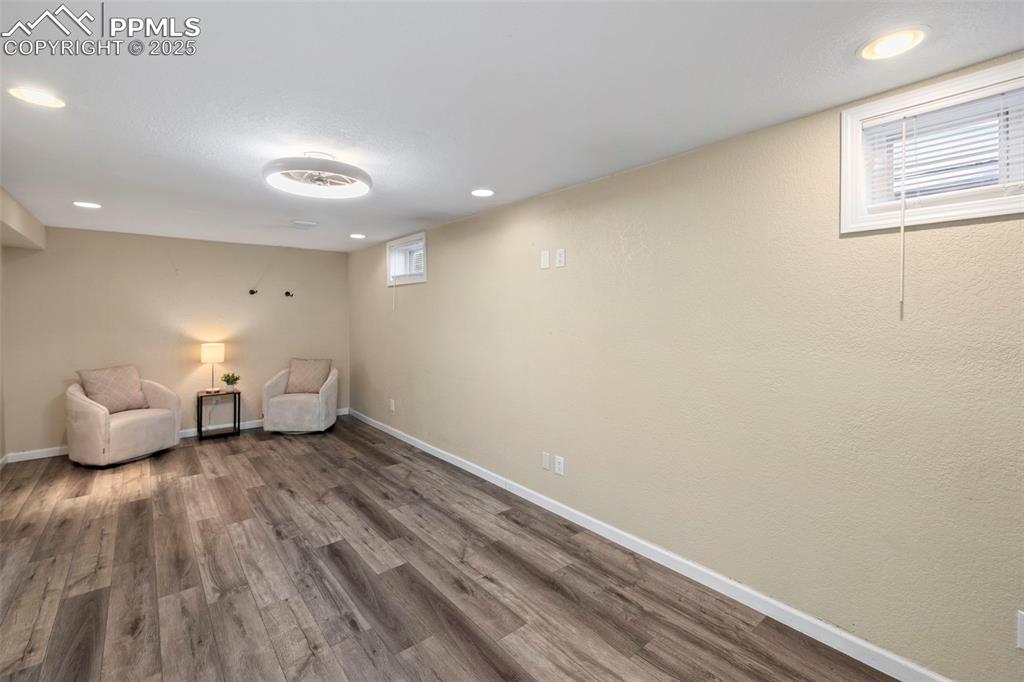 Image 18 of 30: Unfurnished room with recessed lighting and wood finished floors