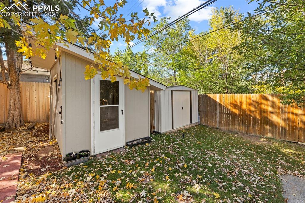 Image 24 of 30: View of shed featuring a fenced backyard
