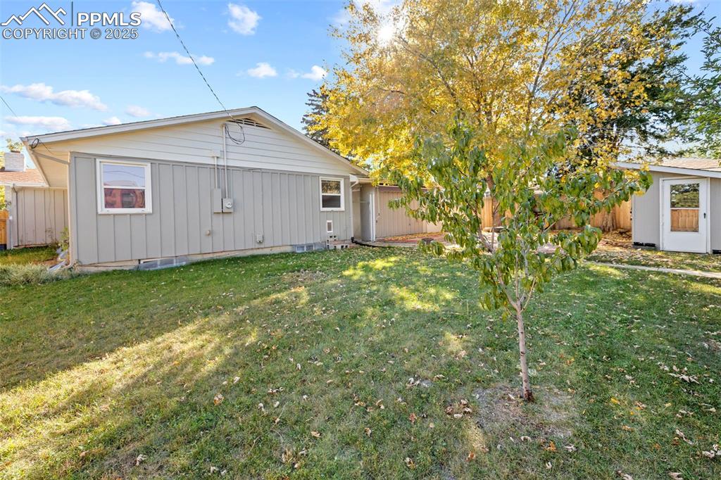 Image 26 of 30: Rear view of property with an outbuilding and crawl space