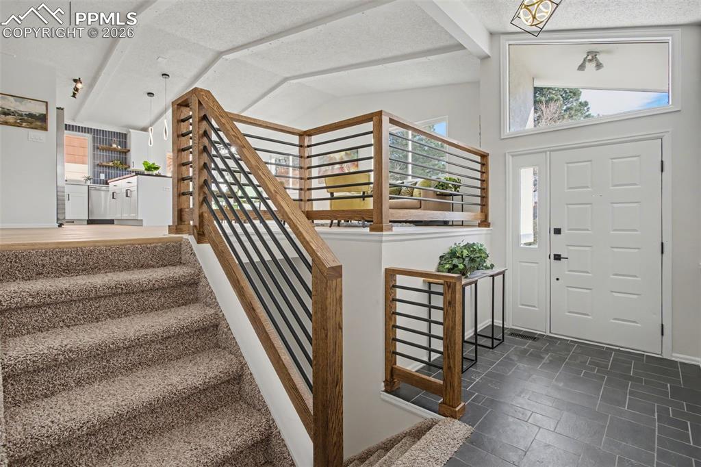 Image 4 of 46: Bright Entry, Custom Railing