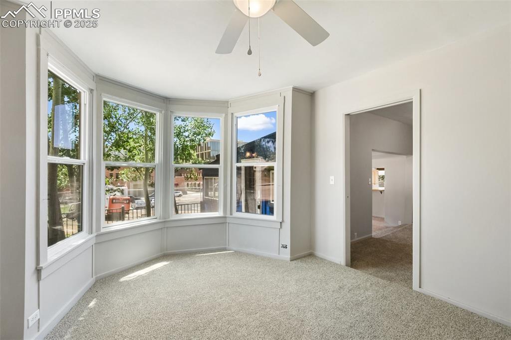 Image 36 of 36: another shot of the bay window and the door leading into the family room