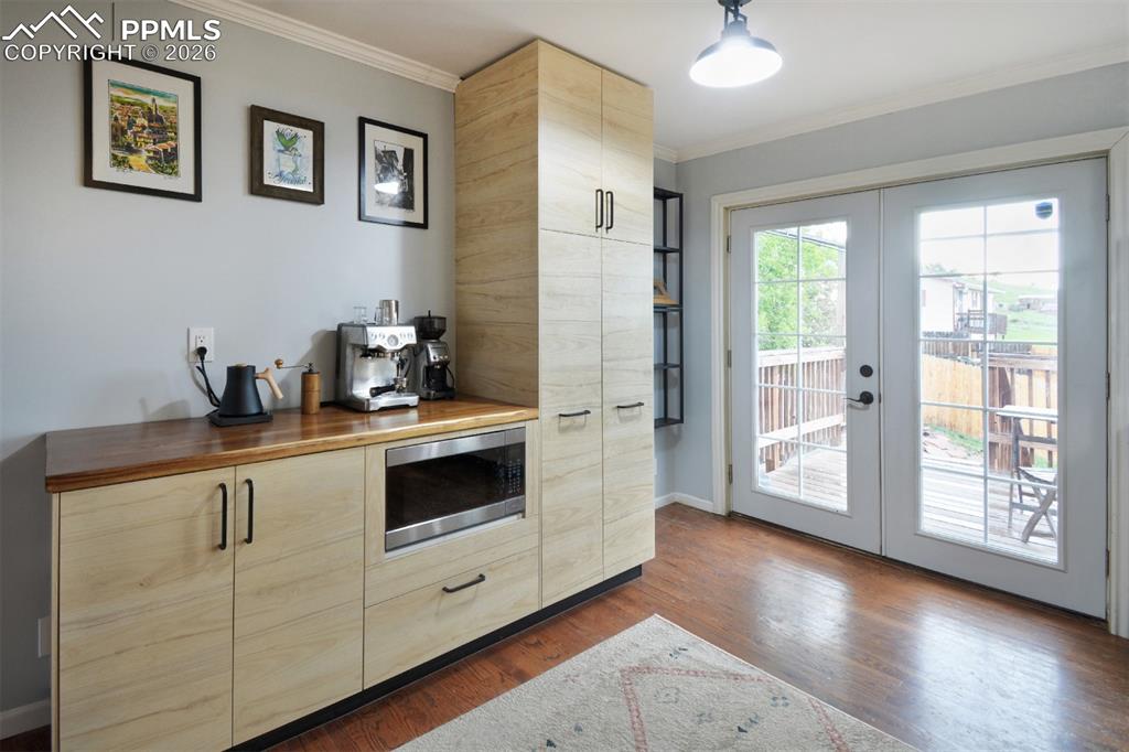 Image 7 of 27: Pantry and Coffee Bar with custom wood counter top perfect for entertaining