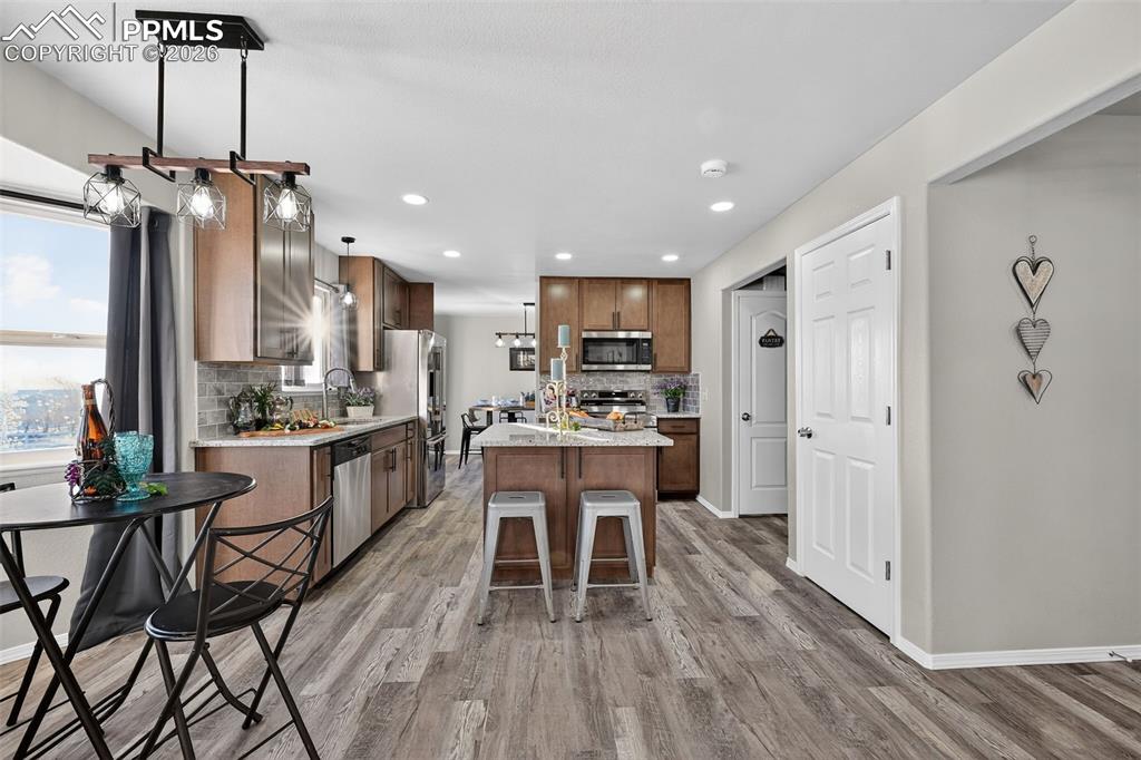 Image 12 of 50: Another view of the kitchen from the main level family room.