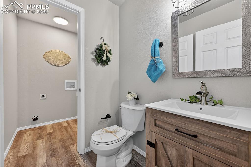 Image 19 of 50: The half bath on the main level. All new!