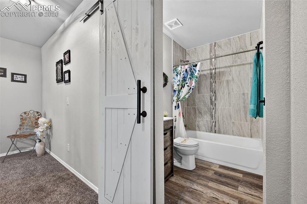 Image 30 of 50: Look at the 2nd floor bathroom! More custom tile.