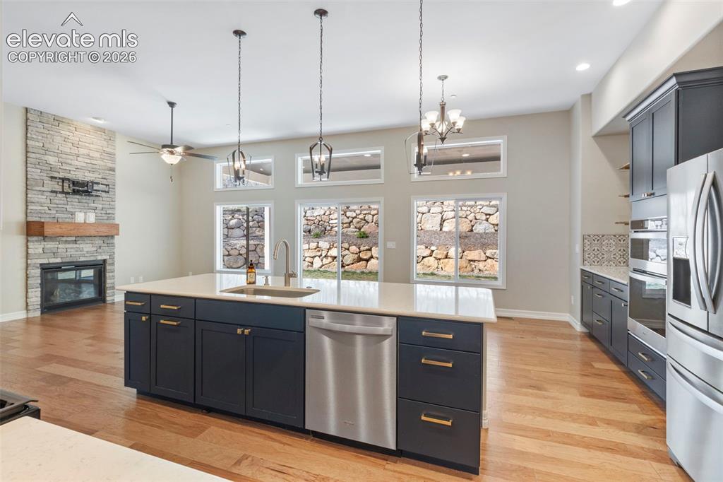 Image 16 of 47: Open-concept living space with wood-finish flooring