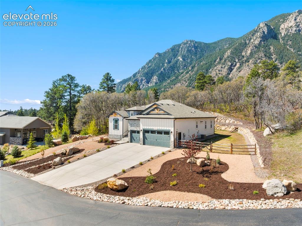 Image 2 of 47: Contemporary exterior with a multi-car driveway and an attached garage