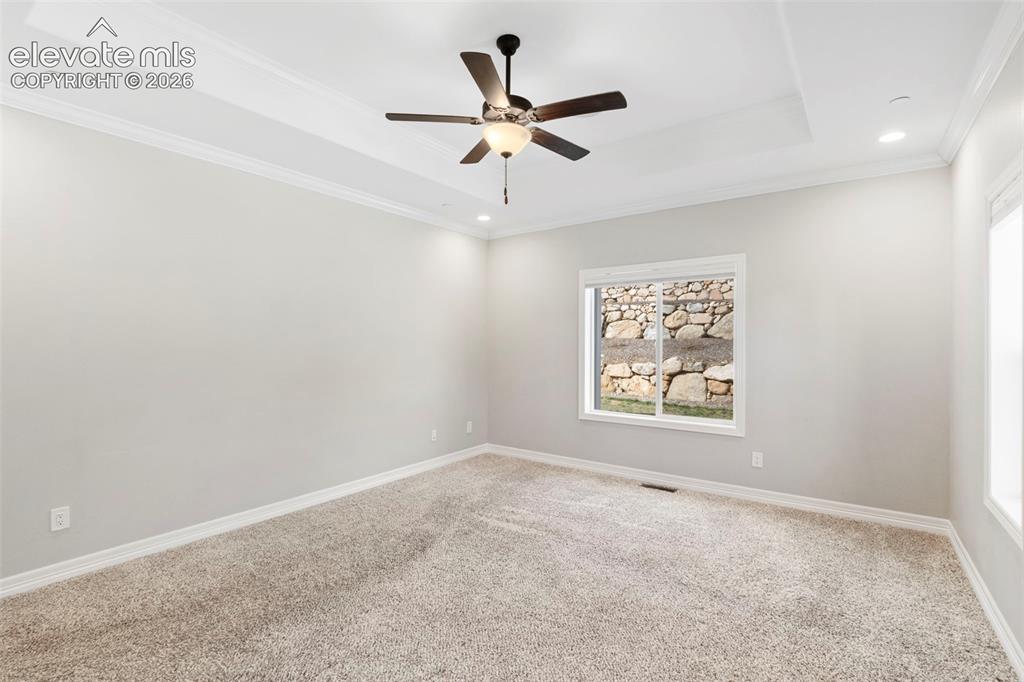 Image 25 of 47: Spacious room featuring neutral carpeting and light-toned walls