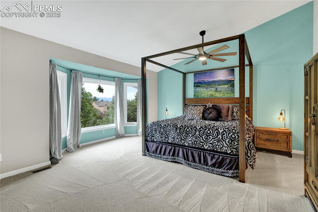 Image 21 of 32: Carpeted bedroom featuring baseboards and a ceiling fan