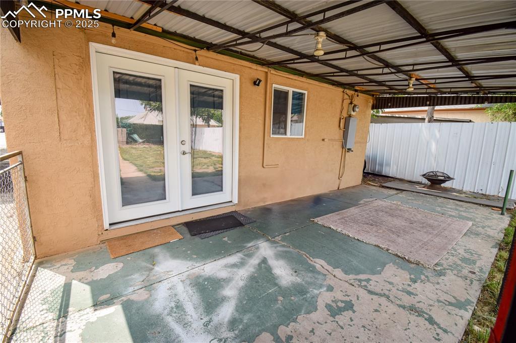 Image 24 of 30: View of patio featuring french doors
