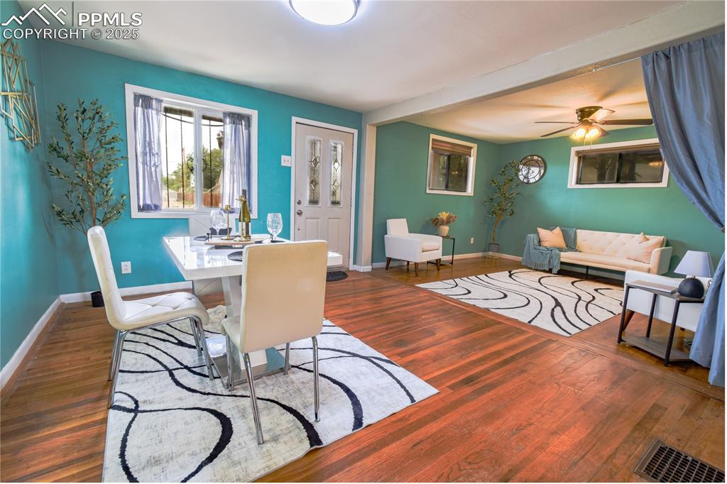 Image 8 of 30: Dining space with baseboards, wood finished floors, and ceiling fan