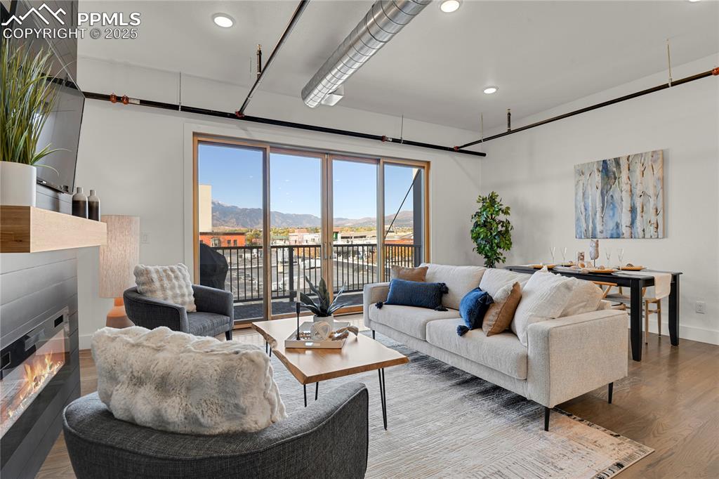 Image 3 of 33: Open floor plan showcases 10’ ceilings, exposed ductwork, and site-finished