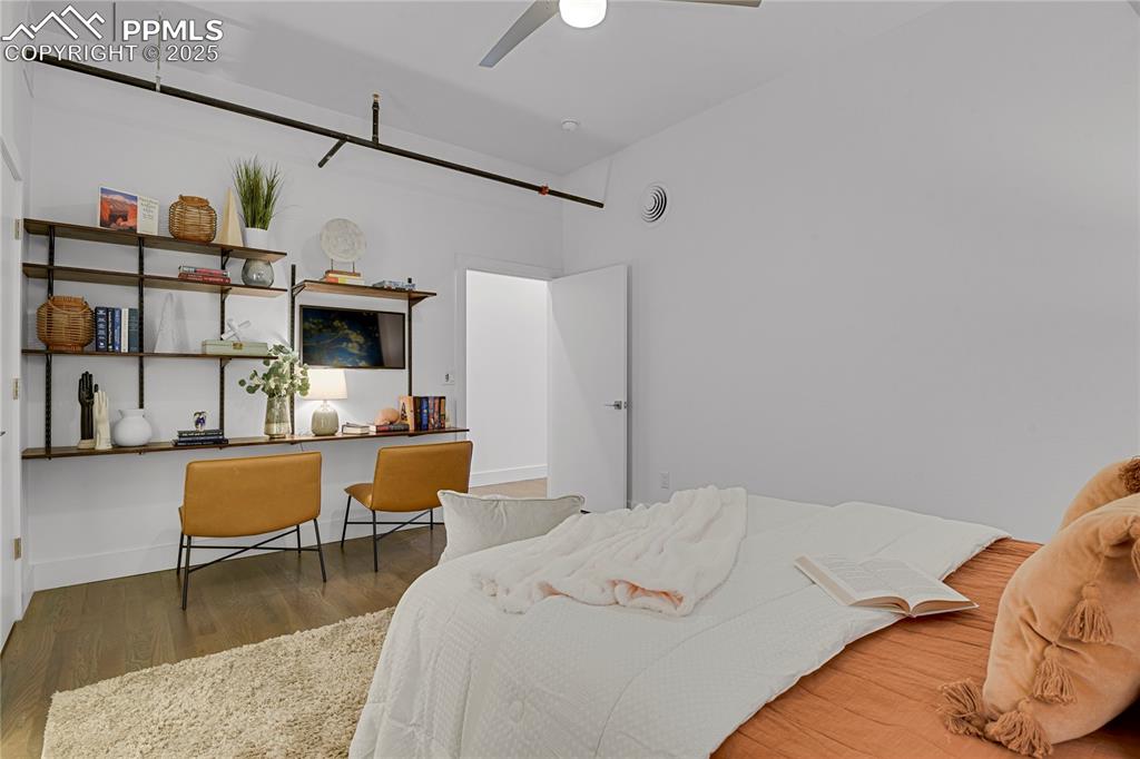 Image 9 of 33: Wall of shelving ideal for home office space!