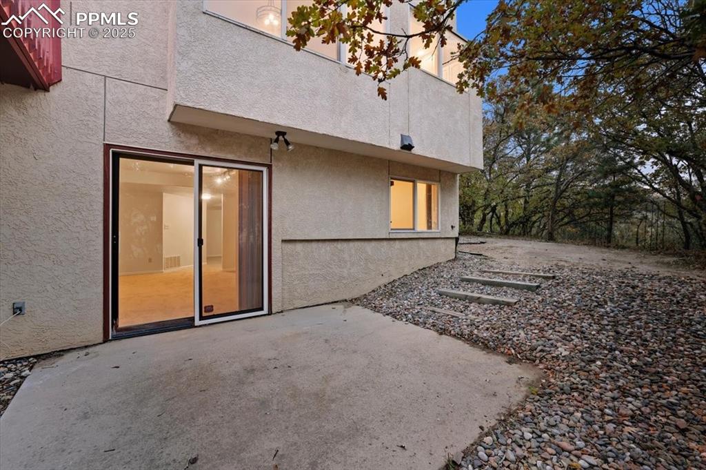 Image 29 of 31: Back of property featuring a patio area and stucco siding