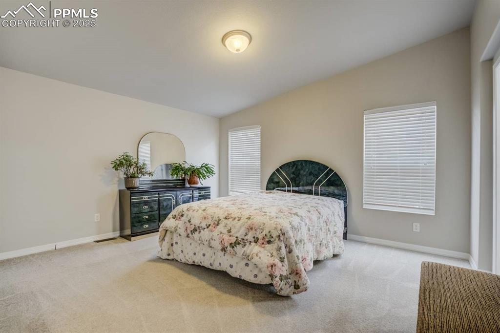 Image 11 of 35: Bedroom featuring carpet floors and baseboards