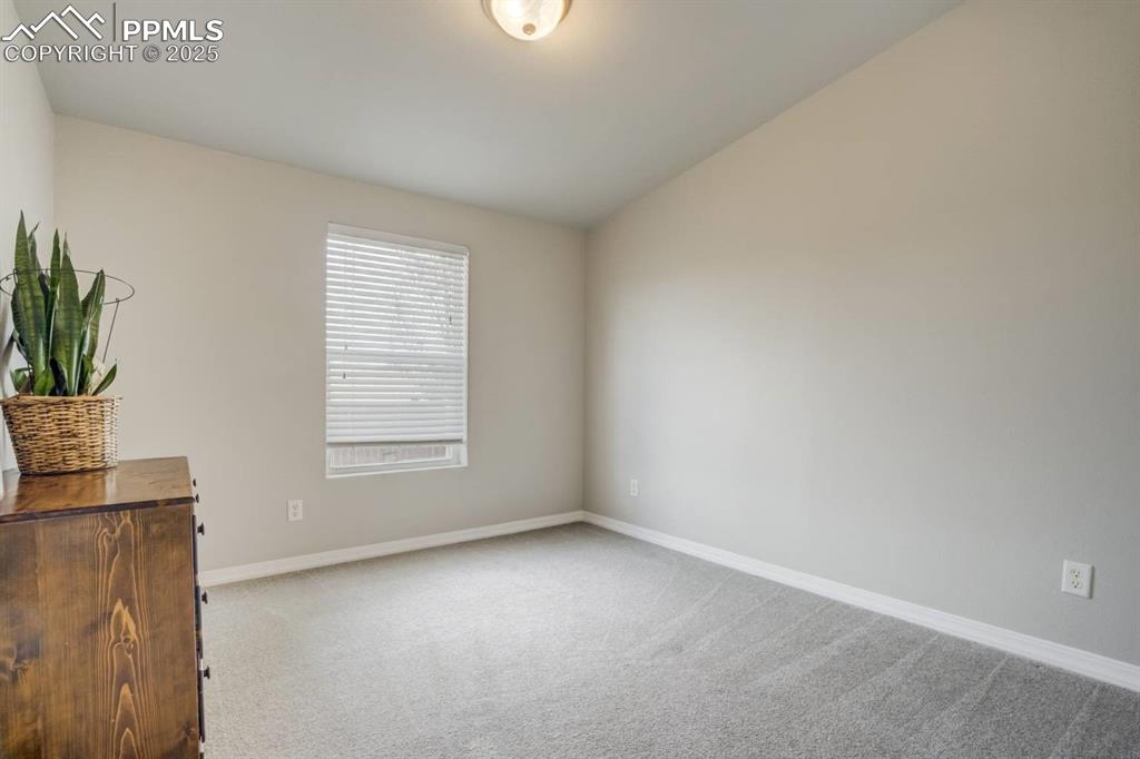 Image 16 of 35: Unfurnished room featuring light carpet and baseboards