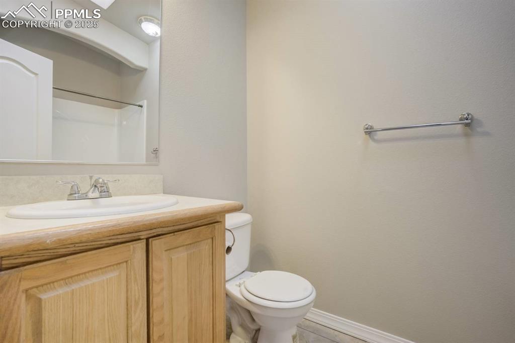 Image 20 of 35: Full bath featuring vanity, light tile patterned floors, and a shower