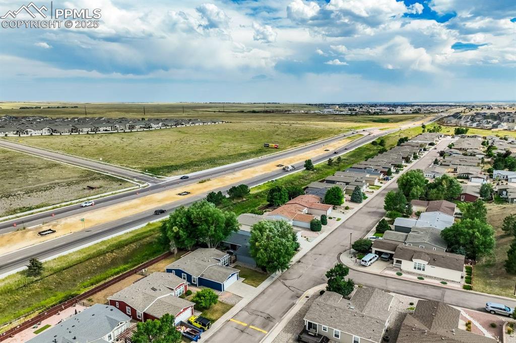 Image 34 of 35: Aerial perspective of suburban area with a highway