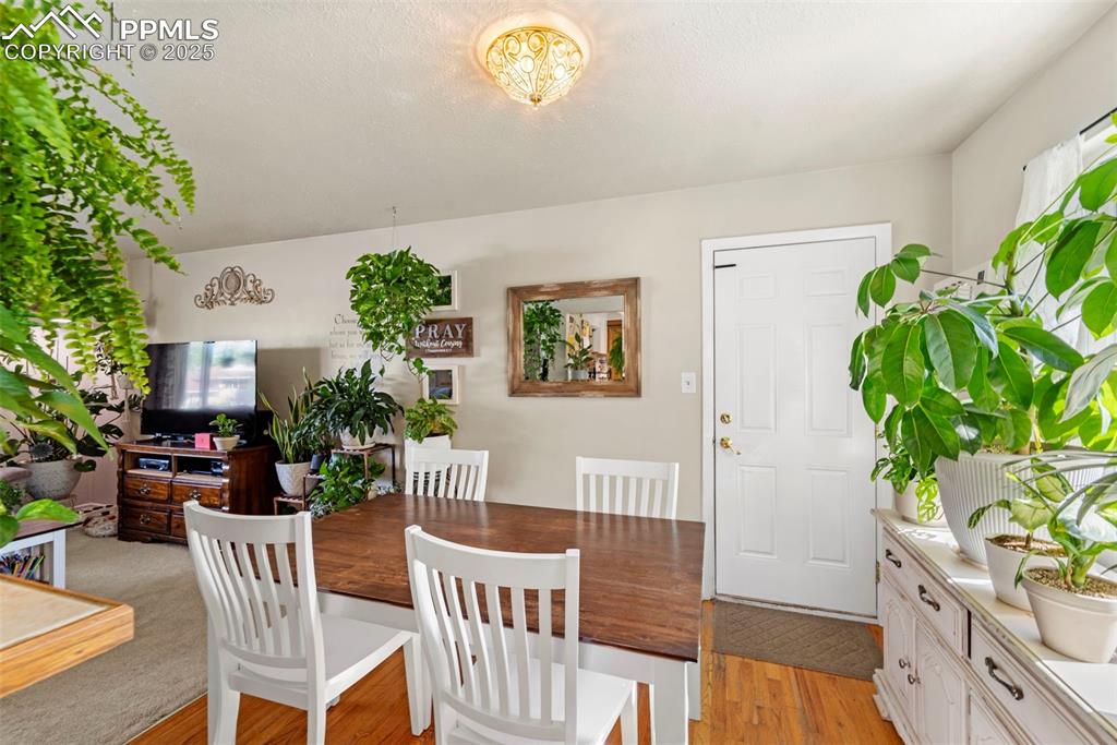 Image 21 of 38: Dining space featuring light wood finished floors