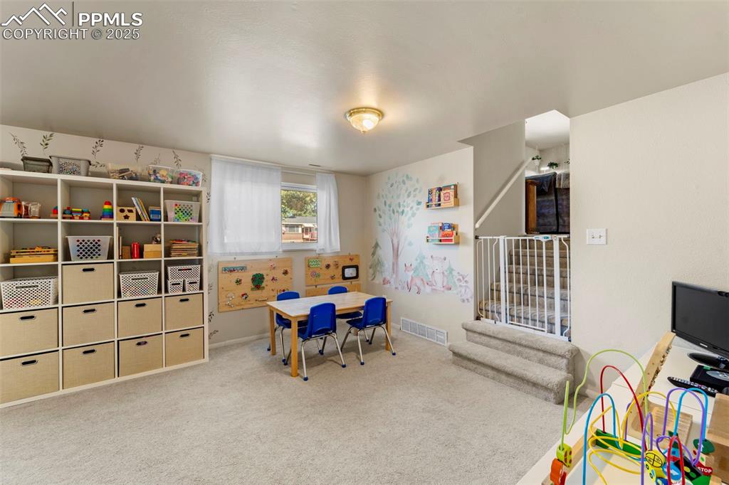 Image 31 of 38: Rec room with carpet floors and baseboards