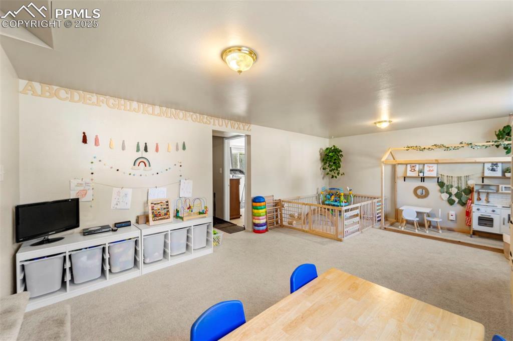 Image 32 of 38: Recreation room with carpet