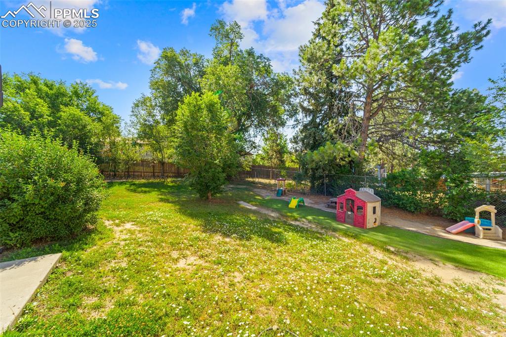 Image 38 of 38: View of fenced backyard