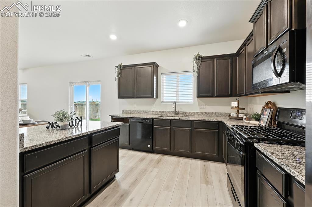 Image 18 of 47: Slider from the Kitchen/Dining Area into the backyard.