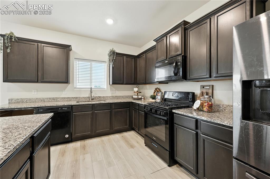 Image 19 of 47: The chef will love cooking in this well equipped kitchen.