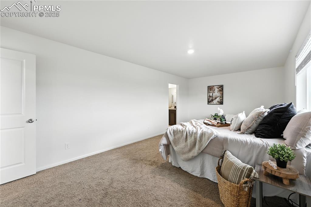 Image 26 of 47: Spacious upper level Primary Suite.