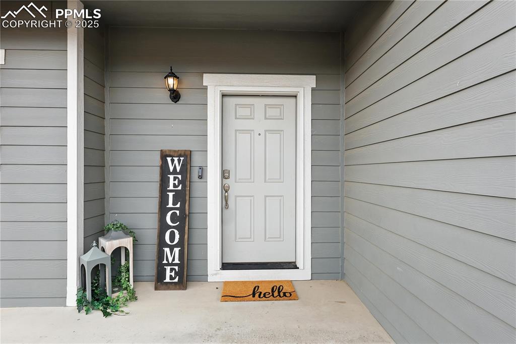 Image 3 of 47: Welcoming covered front porch.