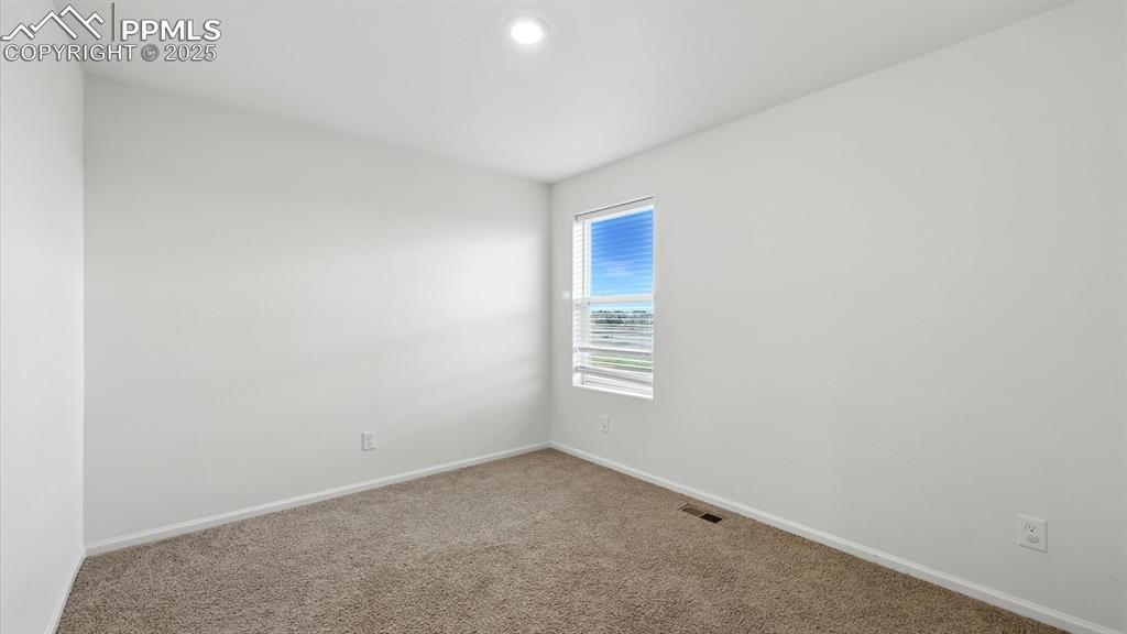 Image 32 of 47: Upper Level Bedroom #2 has neutral carpet.