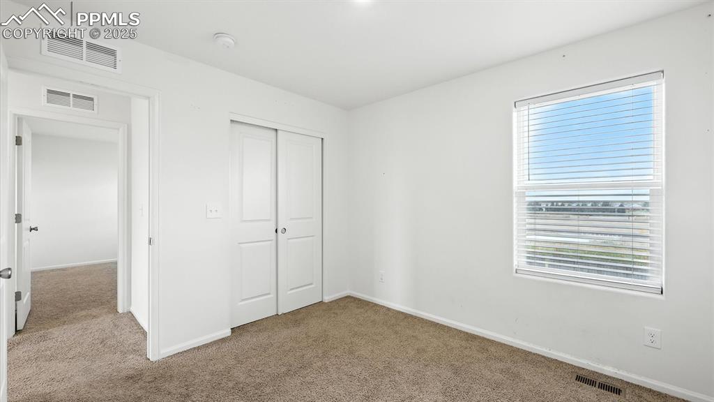 Image 38 of 47: Upper Level Bedroom #3 has a generous closet.