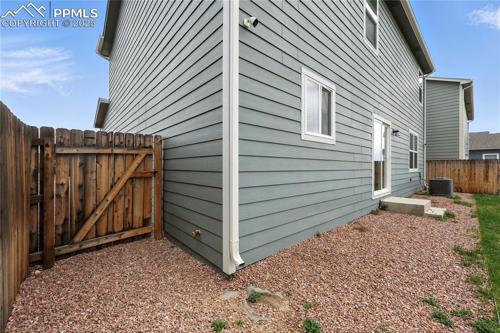 Image 42 of 47: Side gate into the front yard.