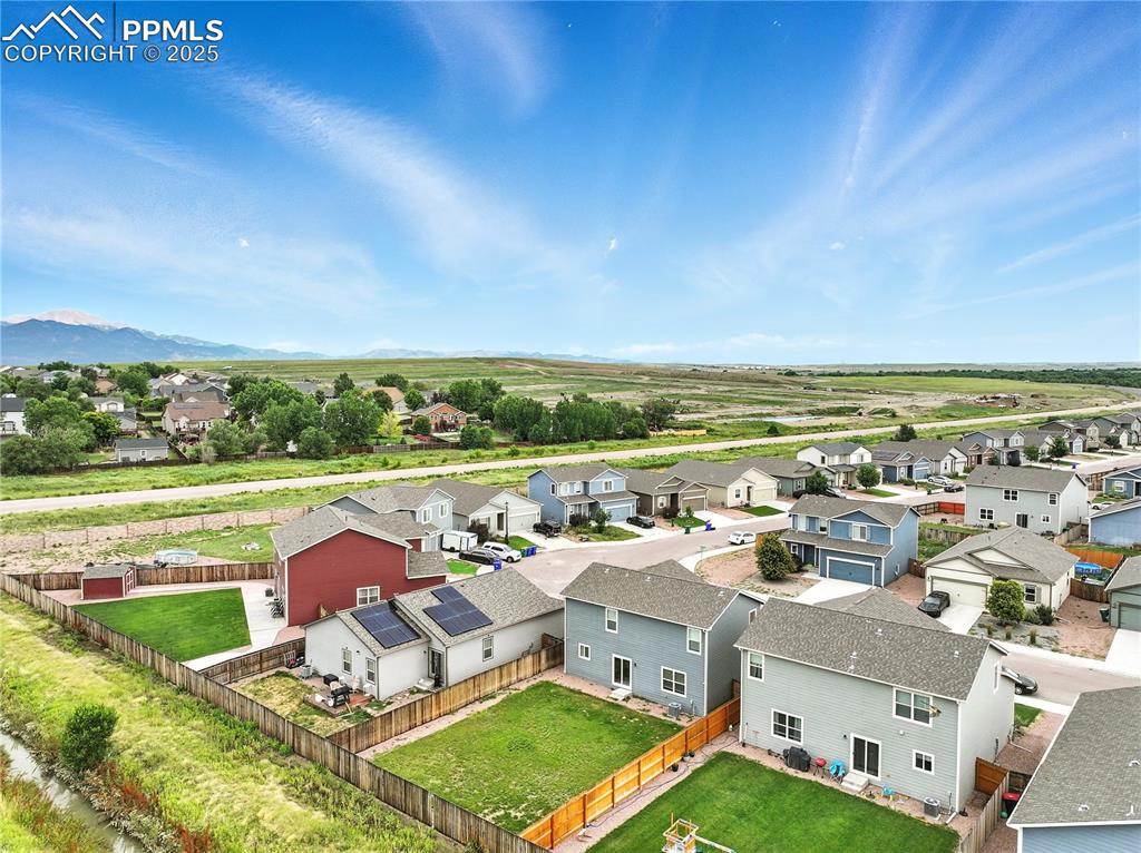 Image 46 of 47: Aerial view of backyard and neighborhood.