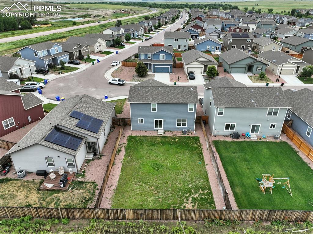 Image 47 of 47: Aerial rear view of home and backyard.
