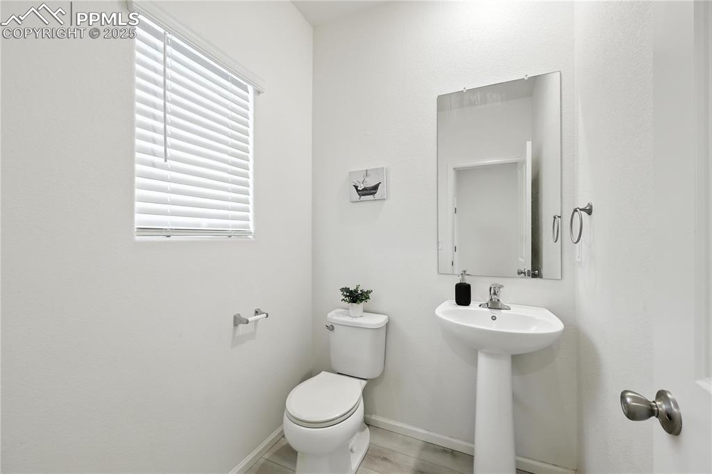 Image 5 of 47: Convenient Powder Bathroom for guests.