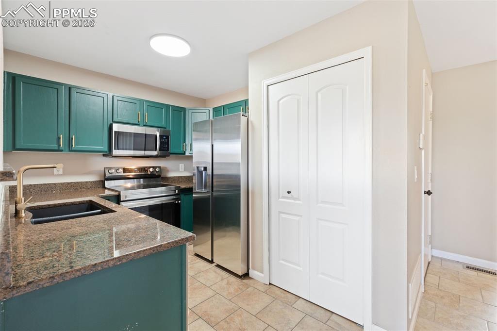 Image 11 of 26: Updated kitchen with granite counters, updated hardware, pantry, and matchi
