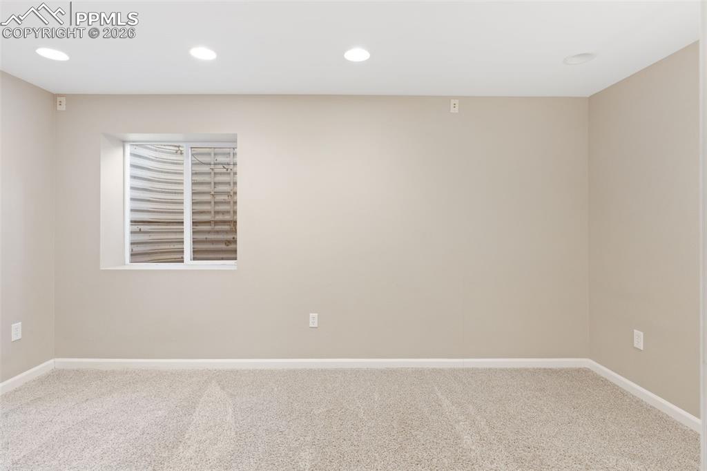 Image 21 of 26: Finished basement boasts a fourth bedroom with large walk-in closet (this r