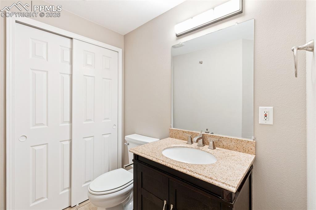 Image 22 of 26: Finished basement also has a newer half bath and closet storage.
