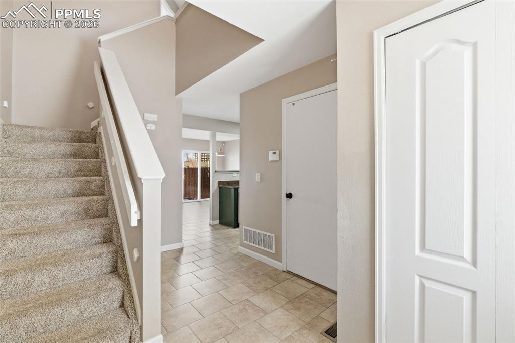 Image 4 of 26: Lovely entry with tile floor.