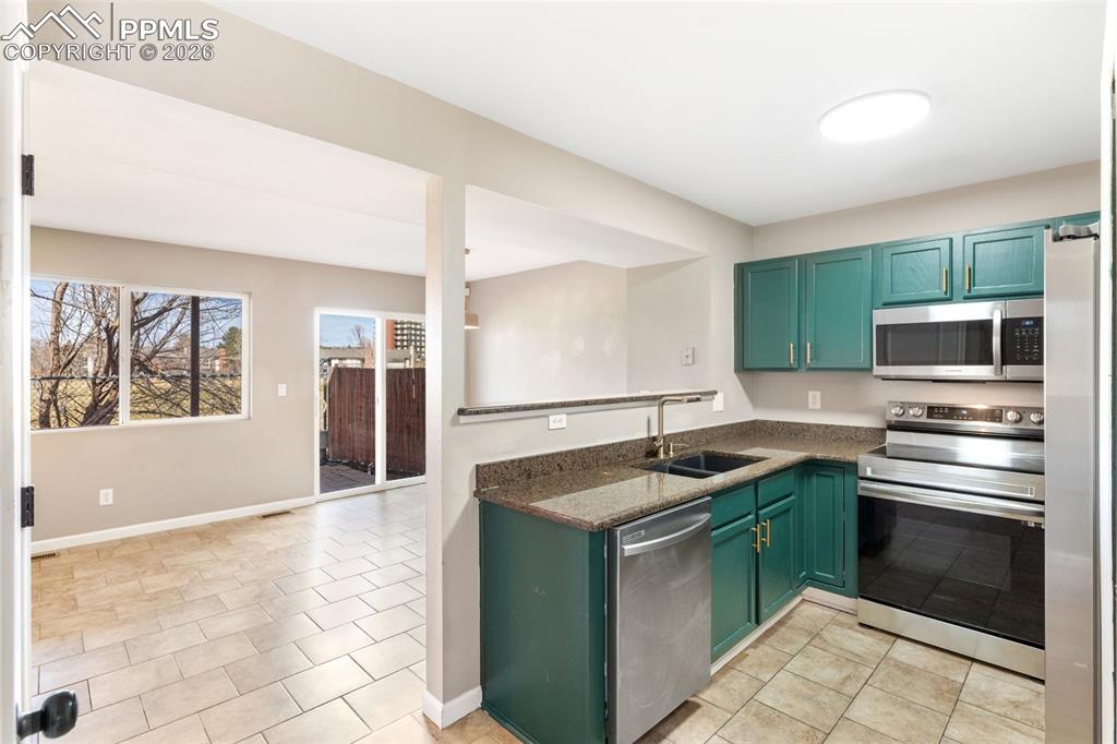 Image 8 of 26: Updated kitchen with granite counters, updated hardware, pantry, and matchi