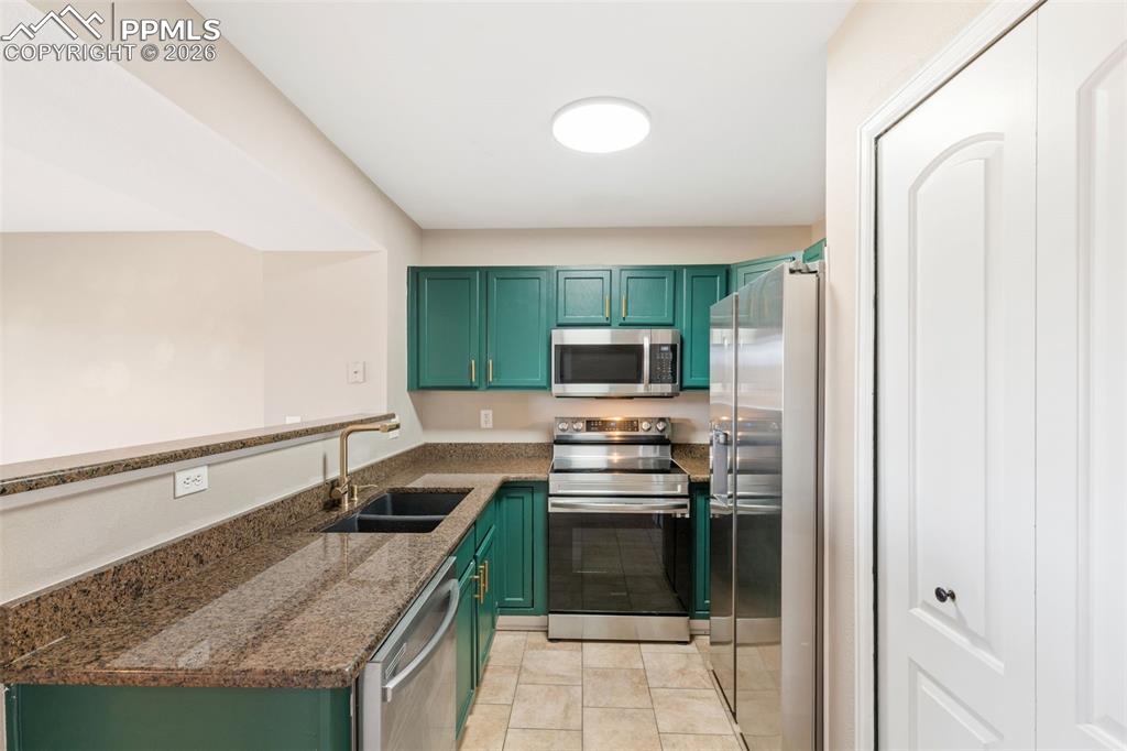 Image 9 of 26: Updated kitchen with granite counters, updated hardware, pantry, and matchi