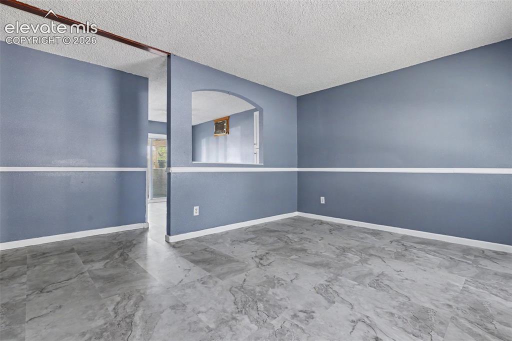 Image 3 of 17: The Living Room is conveniently located to the Kitchen