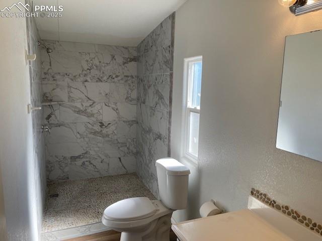 Image 16 of 21: Full bath with vanity and a shower stall