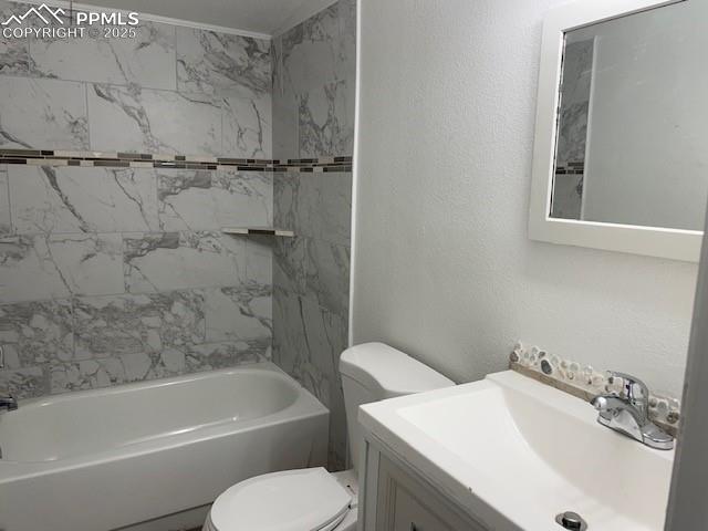 Image 17 of 21: Full bathroom with a textured wall, vanity, and bathing tub / shower combin