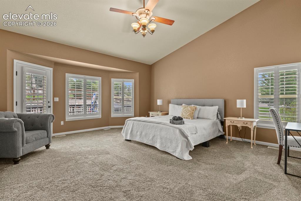 Image 20 of 47: Vaulted ceiling with a ceiling fan light fixture