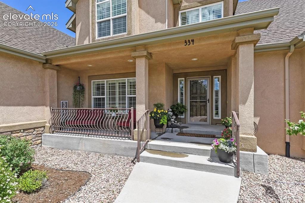 Image 3 of 47: Stucco exterior with stone accenting