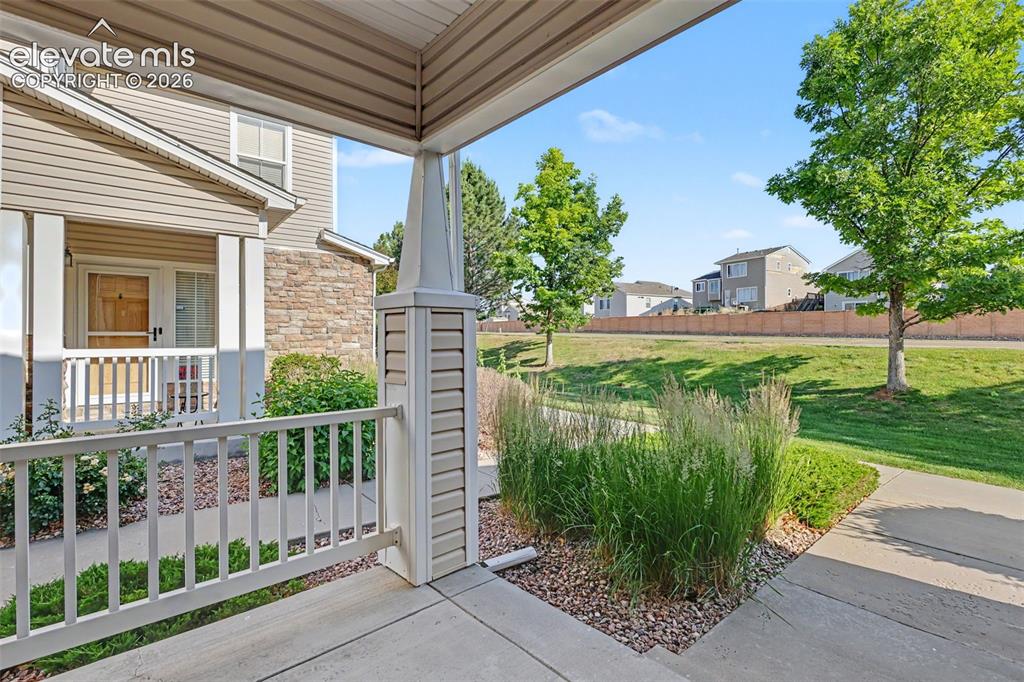 Image 3 of 27: Front porch with white railing