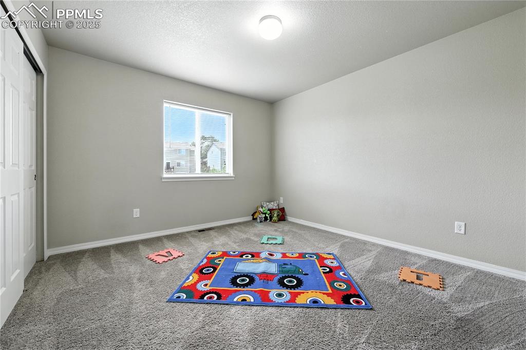 Image 24 of 46: Recreation room featuring carpet floors and baseboards