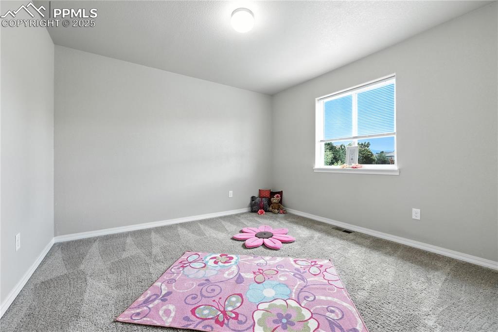 Image 27 of 46: Unfurnished room featuring carpet and baseboards